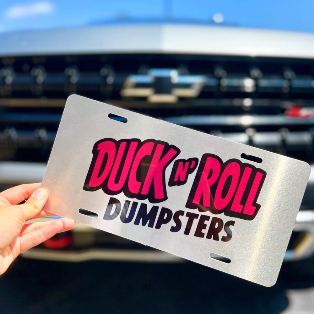 Duck N' Roll Dumpsters Custom sublimated car front plate for Duck N’ Roll Dumpsters.